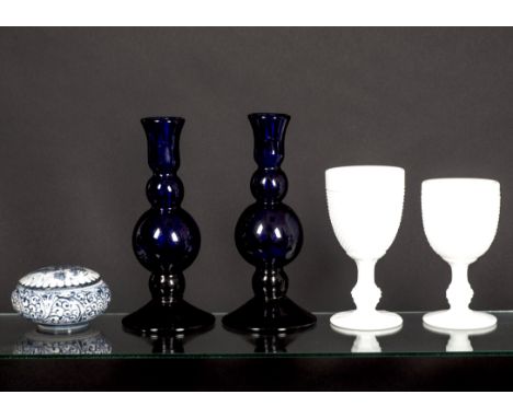 A pair of Thomas Webb Bristol blue candlestick holders,  height 18 cm, together with several opaline glass goblets, and a Del