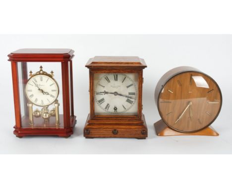A collection of seven mantel clocks by various makers,  including a Smiths retro clock, another by Smiths, a Hamilton &amp; I