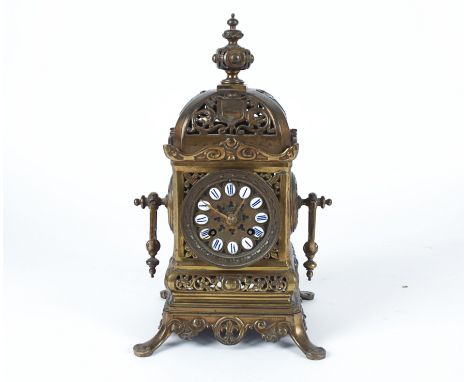  A French brass drum movement mantel clock,  with enamelled roman numerals, on four splayed feet, in bird cage form, height 3