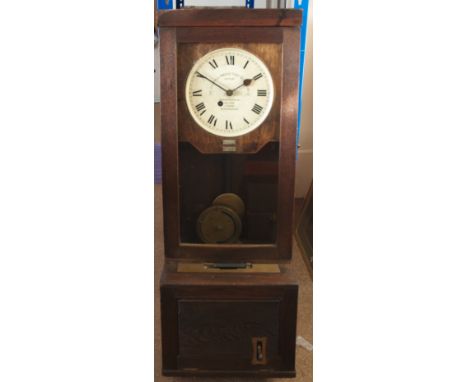A Gledhill-Brook time recorders ltd patent clock,  in a wooden case, with enamel dial behind glass, inscription on dial reads