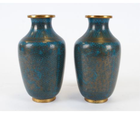 A pair of Asian cloisonné enamel vases,  with uniform turquoise colouring, the intricate metalwork creating concentric circle
