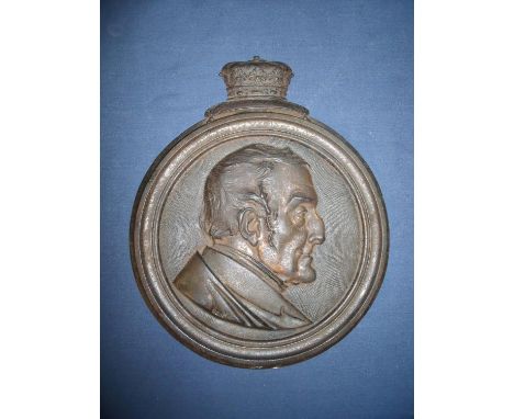 Circular cast metal wall plaque depicting the bust portrait of the duke of wellington with coronet mount, the reverse marked 