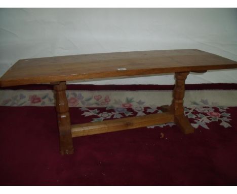 Robert Thompson oak "Mouseman" rectangular bench/coffee table on twin supports with understrecher and detail to the top (44.5