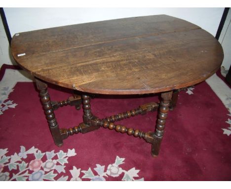 18th/19th C oak dropleaf gate-leg table on bobbin turn supports with single drawer to the end (length 121cm) 