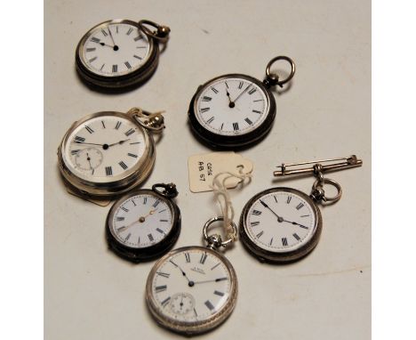 Six various silver cased open face mid size pocket watches, each having engraved or engine turned back covers, unsigned white