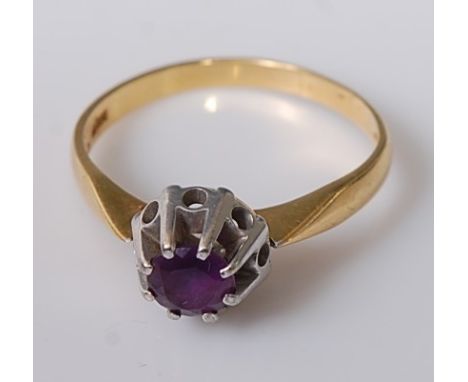 A modern 18ct gold and claw set amethyst dress ring, 2.8g, size K