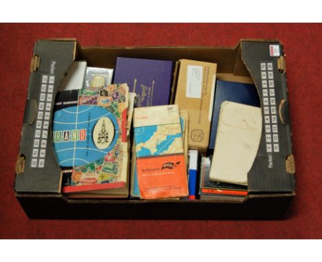 A box of miscellaneous items to include Strand stamp album and contents mainly being 20th century examples, Ordnance Survey m