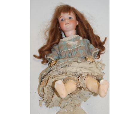 An Armand Marseille bisque head doll, having fixed blue eyes and open mouth with four top teeth showing, with bent limbed com