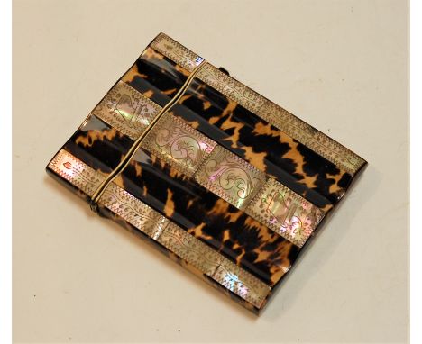 A Victorian tortoiseshell and mother of pearl visiting card case, of serpentine rectangular form, 10 x 8cm