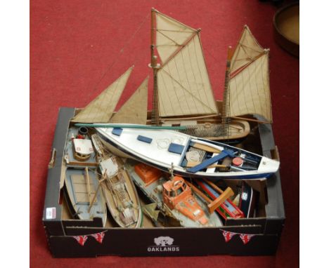 A scratch built model of a lifeboat together with various other yachts, trawlers etc