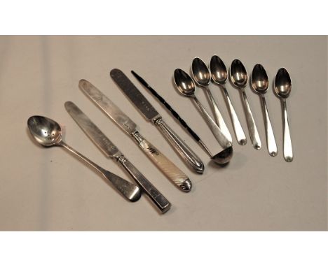 A small collection of assorted loose silver and white metal flatware, to include teaspoons, silver handled knife, toddy ladle