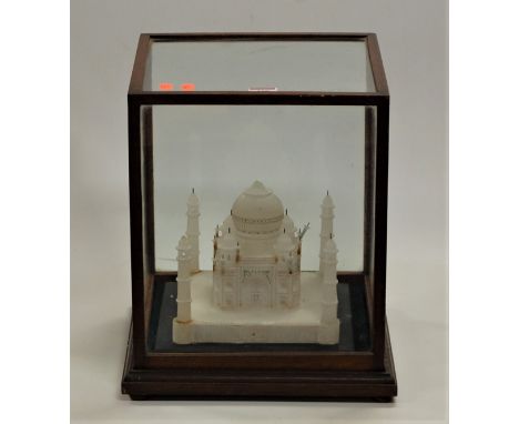 A carved stone model of the Taj Mahal in glazed display case, case dimensions width 31cm, depth 31cm, height 36cm