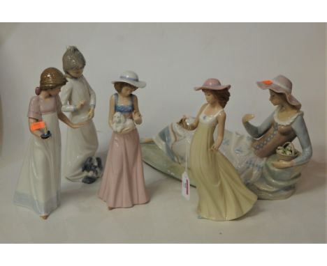 A large Nao Spanish porcelain figure of a reclining female with basket of flowers having impressed mark verso, width 37cm, to