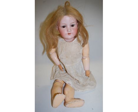 An Armand Marseille bisque head doll, having rolling brown eyes and open mouth, with jointed composition body, stamped Armand