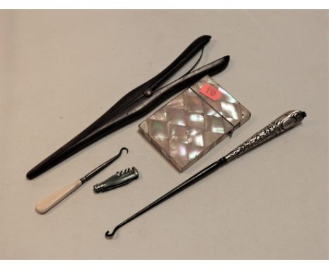A small collection of miscellaneous items, to include Victorian mother of pearl visiting card case, silver handled button hoo