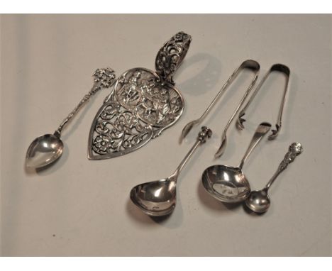 A George III silver caddy spoon, having bright cut decorated bowl and plain stem; together with another silver caddy spoon; a