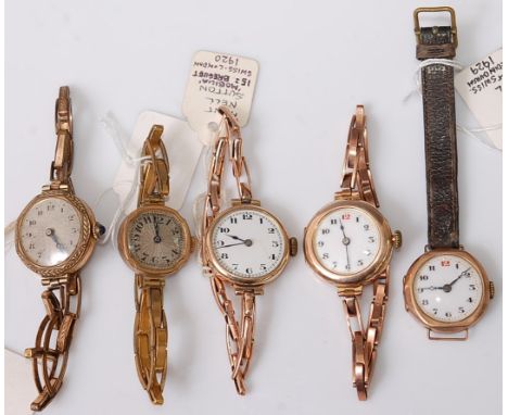 Three vintage lady's 9ct gold cased wristwatches, each having white enamel dial; together with two similar gold plated exampl