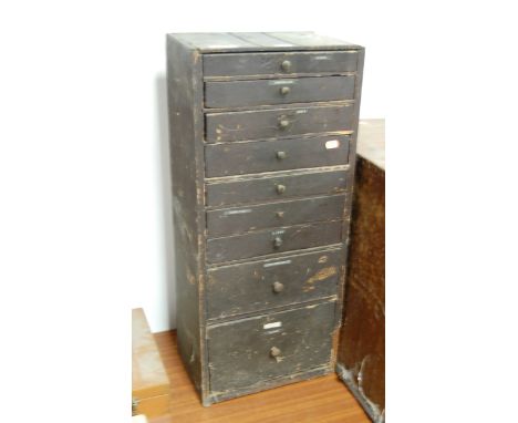 A painted pine collector's chest containing a quantity of watchmaker's and repairer's parts to include crowns, suspensions, v