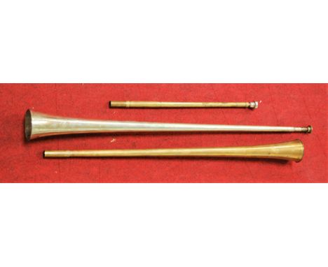 A copper two piece hunting horn together with one other silver plated example, boxed