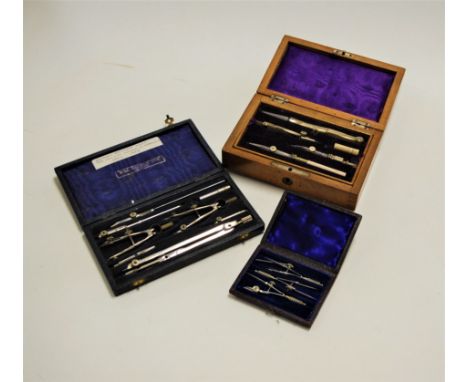 An early 20th century mahogany cased set of draughtsmens / watchmakers tools; together with a leather clad case of similar to