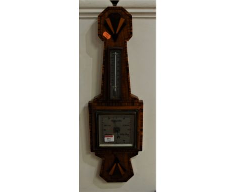A 1930s Art Deco walnut wall barometer, having ebony strung and walnut crossbanded decoration