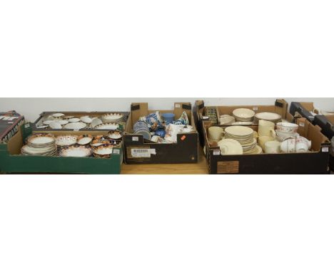 Five boxes containing a quantity of ceramics, to include a Royal Albert part tea set and a Poole Pottery part dinner service