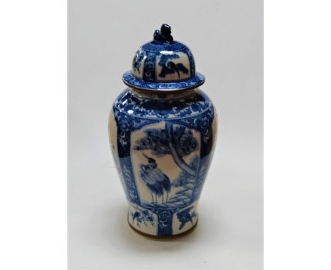 A large reproduction Chinese blue &amp; white jar and cover of baluster form, each panel decorated with flowers, height 50cm