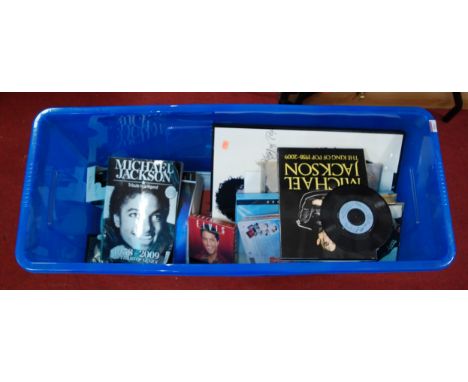 A box containing a collection of items relating to Michael Jackson and Elvis Presley, to include books, CDs, DVDs, film cells