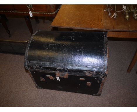 A 19th Century old black painted canvas and leather bound trunk with cloth-lined interior.