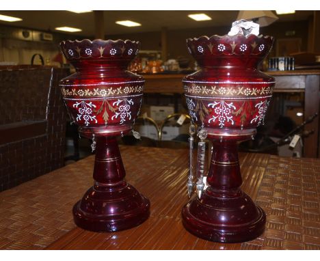 A pair of large ruby tinted Victorian glass vases with hand-painted enamel decoration; together with a quantity of crystal dr