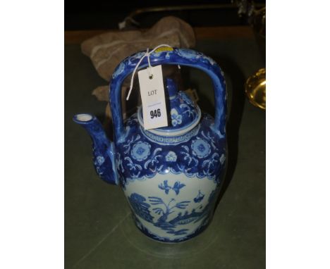 A reproduction blue and white Oriental style teapot.