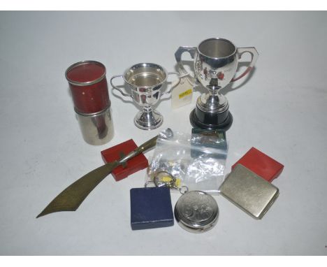 A folding knife and fork picnic set with integrated bottle opening, by Whitby & Co., cased; together with two shooting trophi