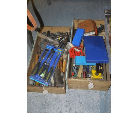 A collection of hand tools, including: chisels; craft knives; etc., in two boxes.