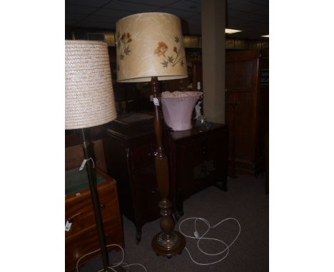 A mahogany standard lamp with turned and reeded column; and a circular mahogany and brass base, together with a floral patter
