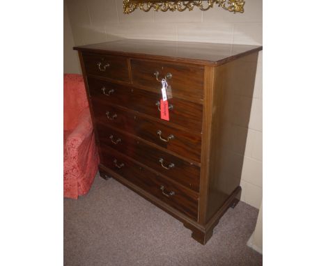 An early 20th Century Georgian style mahogany chest of drawers with reeded edge, above two short and four long graduating dra