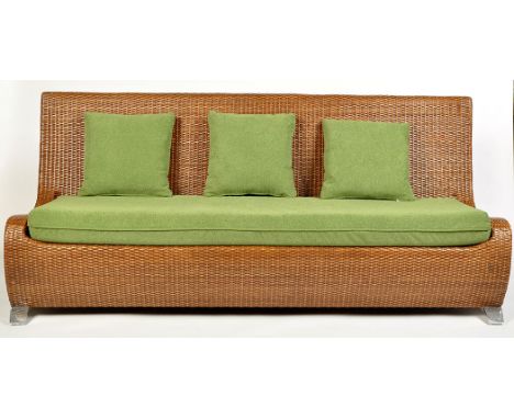 A 'Celestia' three-seater sofa, rattan and bamboo with rectangular green cushion and aluminium legs