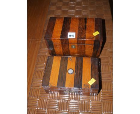 A 19th Century rectangular former tea caddy, the exterior veneered in strips of rosewood and walnut; and another similar box.
