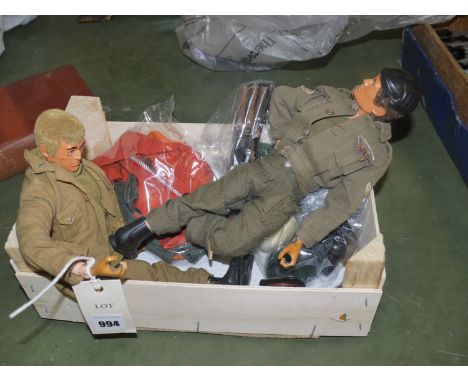 Two 1960's Action Man figures in military uniforms; and a quantity of accessories.