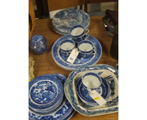 A collection of miscellaneous blue and white, mainly 'Willow' pattern china, comprising: cups; saucers; plates; tureens; etc.
