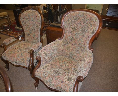 A lady's and gent's Victorian mahogany framed armchairs, both recently re-upholstered in tapestry patterned material, both ra