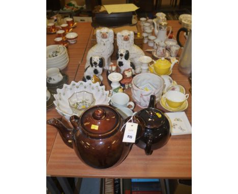 A quantity of assorted ceramics, including: two pairs of Staffordshire dogs; a greyhound; earthenware teapots; a 'Paladin' ch