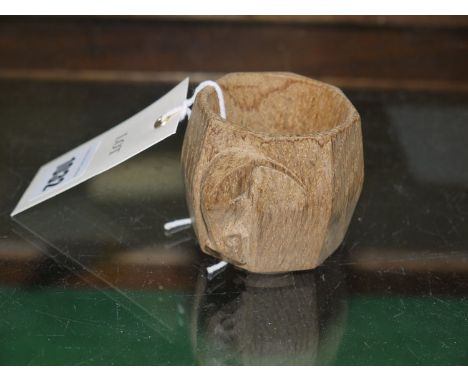 Thomson of Kilburn: a Mouseman carved oak serviette ring with mouse motif.