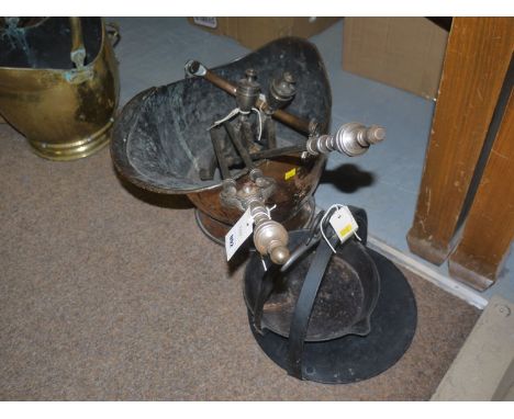 A 19th Century copper helmet-shaped coal scuttle; a pair of steel andirons; a pair of steel coal tongs and matching poker; an