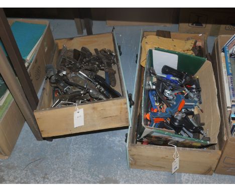 A collection of hand tools, including: adjustable spanners; grips; clamps; scrapers; etc.