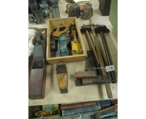 A collection of wood working tools, including: black and block planes; brass and mahogany plane; various metal planes; set sq