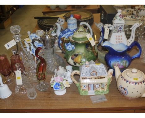 A quantity of glassware, including: a claret jug; a decanter; Oriental teapots; novelty teapot; crested china; etc.