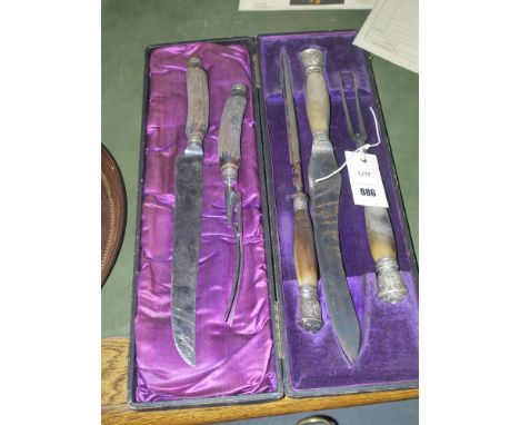 A 19th Century three-piece carving set with horn and silver mounted handles, in fitted case; together with another similar ca