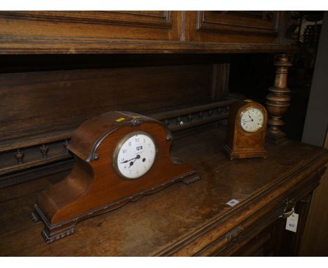 An early 20th Century mantel clock in inlaid figured walnut case; and another mantel clock in mahogany case with carved decor