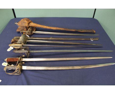 A collection of eight various swords including Victorian examples (only one with scabbard and most as found)