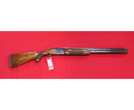 A 12 bore O/U shotgun by Miroku, S/No.607386, 26" barrels with good bores, selective safety and single trigger, this item can